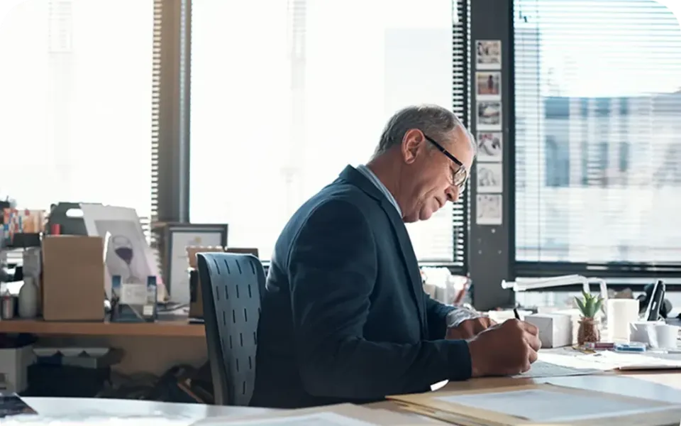Consultant working at a desk in a bright office
